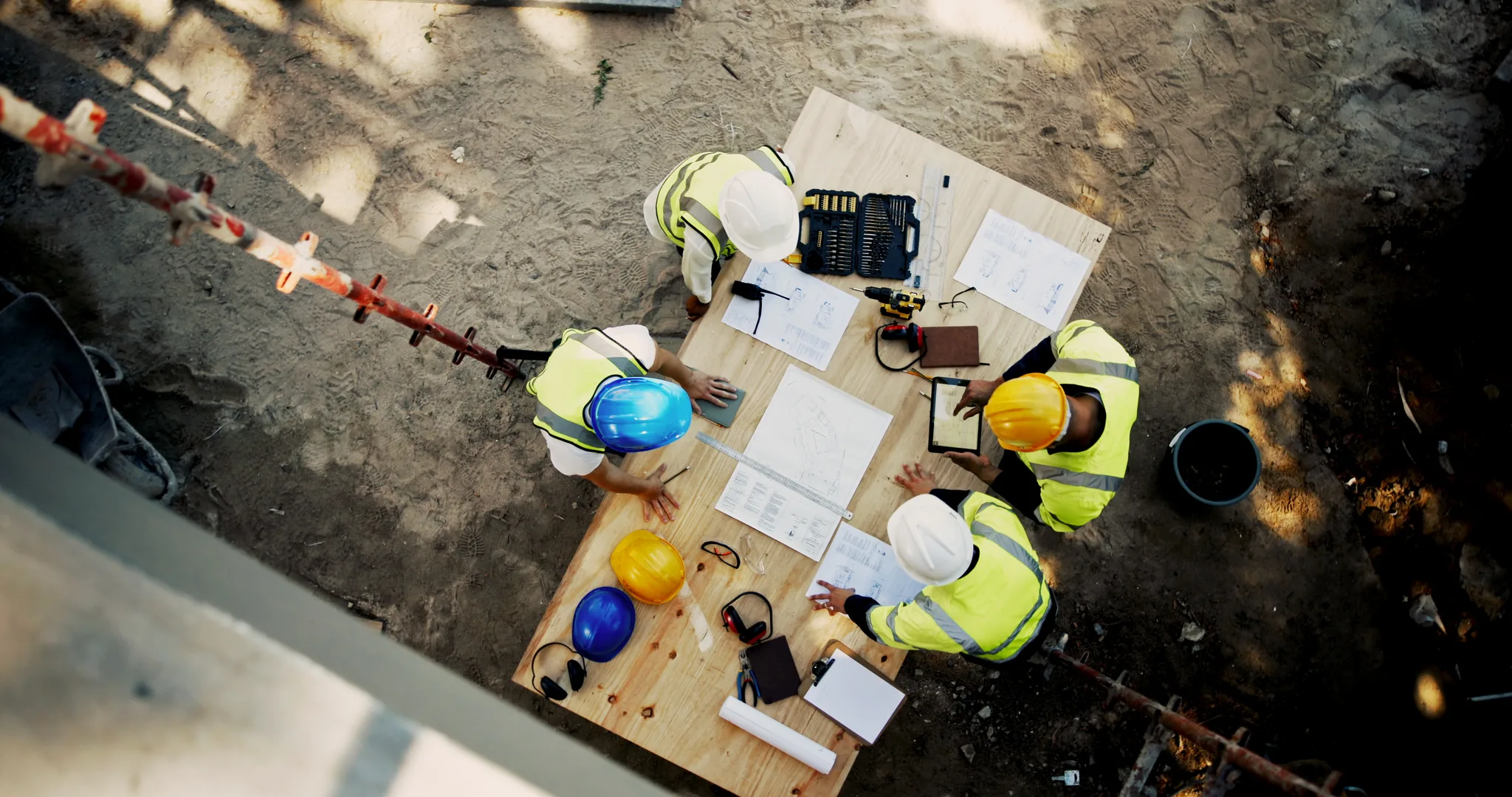 Construction team gathered around work plans